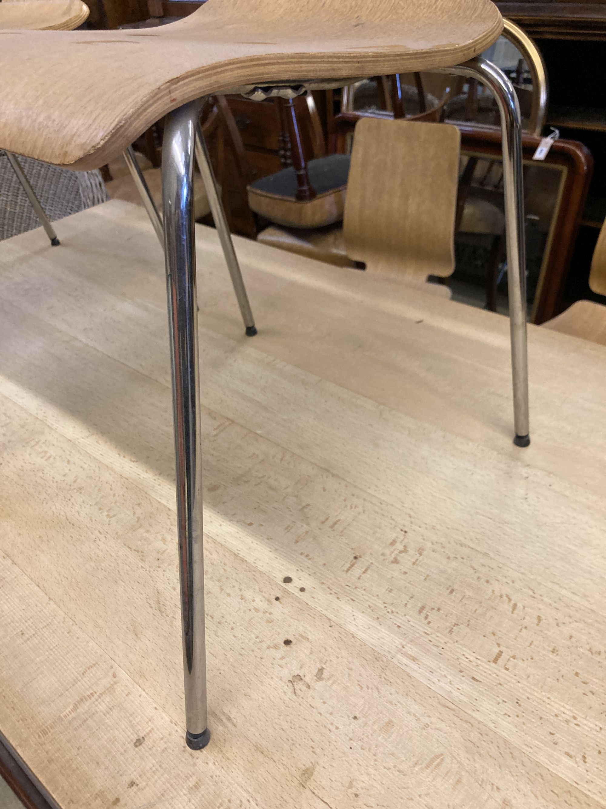 A set of four mid century design bentwood and chrome dining chairs